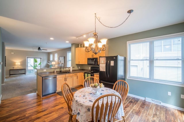 739 Shore Ln, West Bend, WI 53090 - dining room featuring a chandelier, baseboards, dark wood finished floors, ceiling fan, and recessed lighting