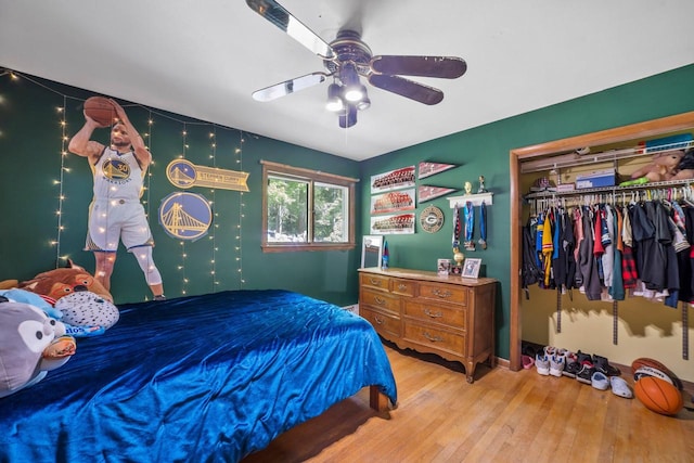 1104 Cavalier Dr, Waukesha, WI 53186 - bedroom with hardwood / wood-style flooring, a closet, and ceiling fan