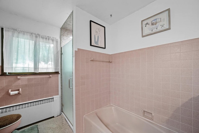 1104 Cavalier Dr, Waukesha, WI 53186 - full bathroom featuring radiator heating unit, a shower with door, tile walls, and a tub to relax in
