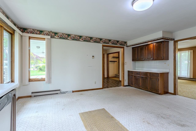 419 E Beech St, Edgar, WI 54426 - kitchen featuring baseboard heating, healthy amount of natural light, light colored carpet, and baseboards