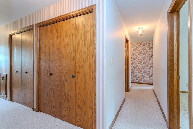 419 E Beech St, Edgar, WI 54426 - hallway with light colored carpet, wallpapered walls, and baseboards