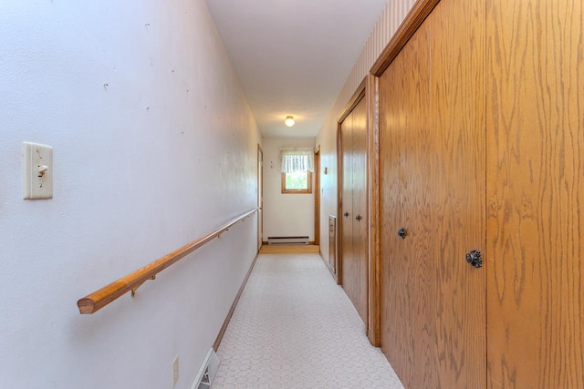 419 E Beech St, Edgar, WI 54426 - hallway with baseboard heating, baseboards, and light colored carpet