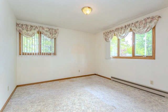 419 E Beech St, Edgar, WI 54426 - carpeted spare room featuring a baseboard heating unit and baseboards
