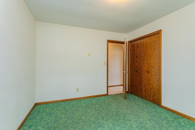 419 E Beech St, Edgar, WI 54426 - unfurnished bedroom with carpet floors, baseboards, and a closet