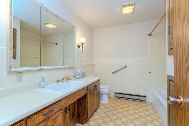 419 E Beech St, Edgar, WI 54426 - bathroom featuring a baseboard radiator, tile walls, vanity, shower / washtub combination, and tile patterned floors
