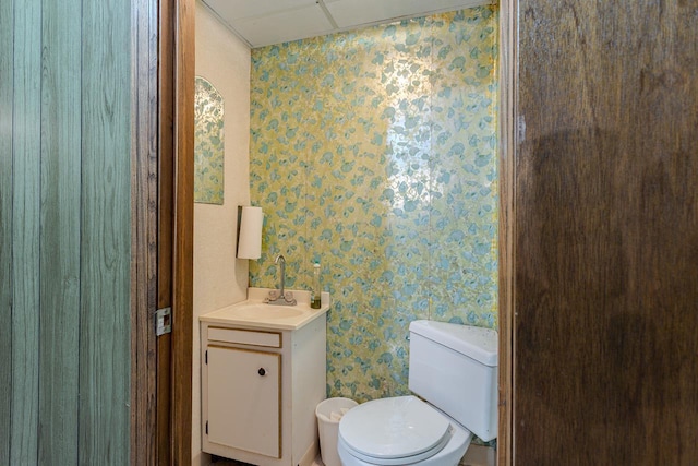 419 E Beech St, Edgar, WI 54426 - half bathroom with wallpapered walls, vanity, and toilet