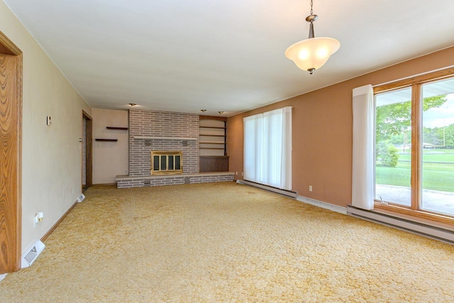 419 E Beech St, Edgar, WI 54426 - unfurnished living room featuring healthy amount of natural light, carpet flooring, baseboards, and a baseboard heating unit