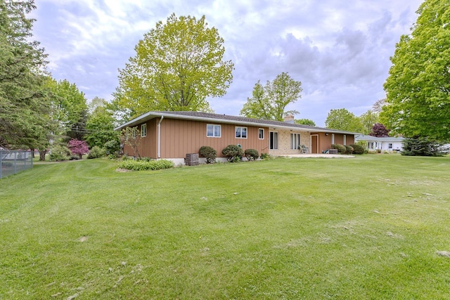 419 E Beech St, Edgar, WI 54426 - view of front of home featuring a chimney and a patio area
