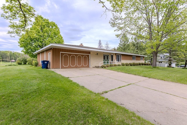 419 E Beech St, Edgar, WI 54426 - ranch-style house featuring an attached garage, a front lawn, concrete driveway, and a chimney