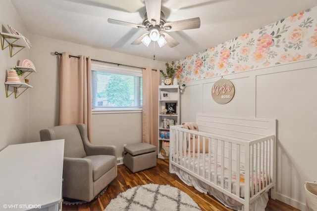 2590 S 91st St, West Allis, WI 53227 - bedroom featuring a crib, wood finished floors, and ceiling fan