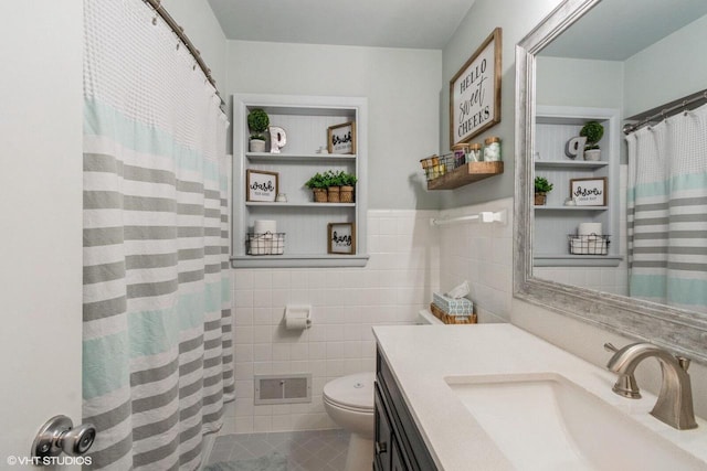 2590 S 91st St, West Allis, WI 53227 - full bath with toilet, vanity, tile walls, tile patterned floors, and a shower with curtain