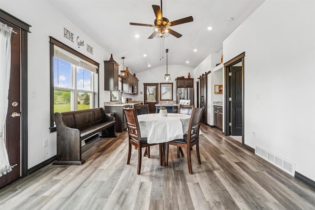3815 Stone Wall Dr, De Pere, WI 54115 - dining area with vaulted ceiling, light wood-style flooring, recessed lighting, a ceiling fan, and baseboards