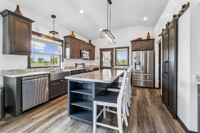 3815 Stone Wall Dr, De Pere, WI 54115 - kitchen featuring stainless steel appliances, a sink, lofted ceiling, dark brown cabinetry, and open shelves