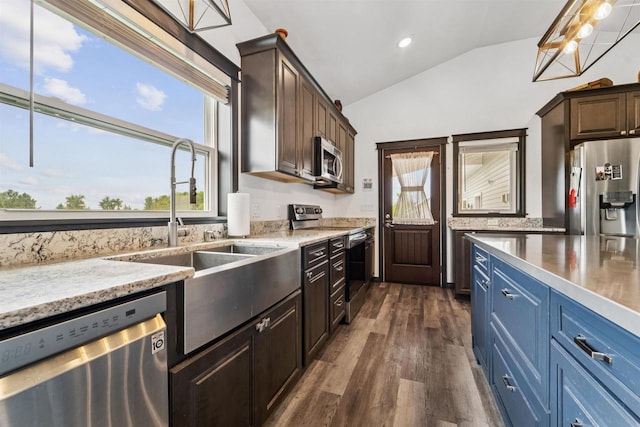 3815 Stone Wall Dr, De Pere, WI 54115 - kitchen featuring appliances with stainless steel finishes, lofted ceiling, plenty of natural light, dark wood-style floors, and a sink