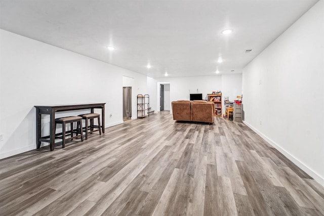 3815 Stone Wall Dr, De Pere, WI 54115 - living room featuring wood finished floors, recessed lighting, and baseboards