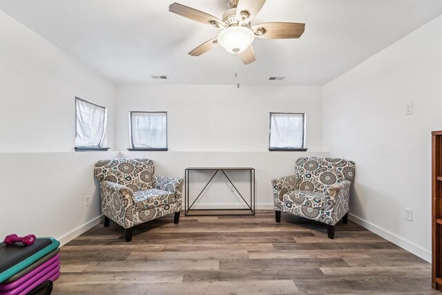3815 Stone Wall Dr, De Pere, WI 54115 - sitting room featuring a ceiling fan, wood finished floors, and baseboards