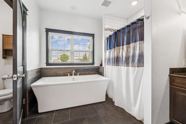 3815 Stone Wall Dr, De Pere, WI 54115 - bathroom with toilet, a soaking tub, tile patterned floors, vanity, and a shower with shower curtain