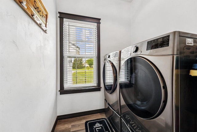 3815 Stone Wall Dr, De Pere, WI 54115 - washroom with separate washer and dryer, wood finished floors, and baseboards