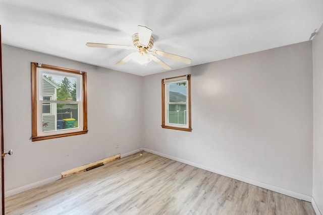 1945 Eastman Ave, Green Bay, WI 54302 - empty room featuring light wood-type flooring, baseboards, and a ceiling fan
