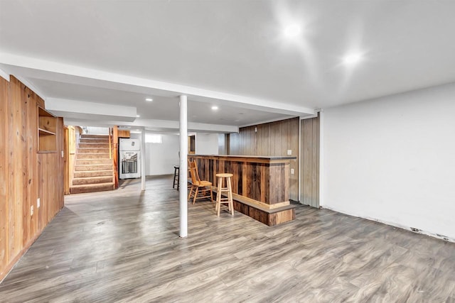 1945 Eastman Ave, Green Bay, WI 54302 - indoor dry bar featuring wooden walls, stairway, wood finished floors, fridge, and recessed lighting