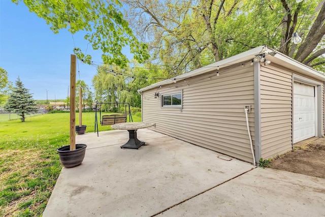 1945 Eastman Ave, Green Bay, WI 54302 - view of patio with a detached garage