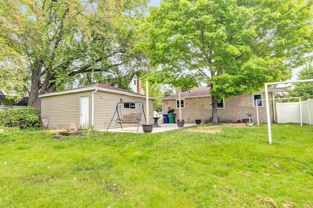 1945 Eastman Ave, Green Bay, WI 54302 - view of yard featuring a patio and an outdoor structure