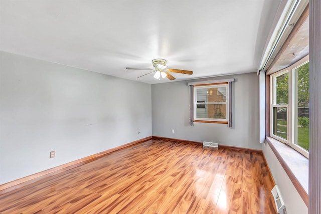 1945 Eastman Ave, Green Bay, WI 54302 - spare room with a ceiling fan, light wood finished floors, and baseboards