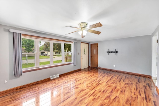 1945 Eastman Ave, Green Bay, WI 54302 - empty room featuring light wood-style floors, ceiling fan, and baseboards