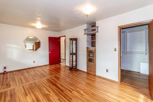 N2594 State Road 76, Hortonville, WI 54944 - spare room featuring light wood-style flooring and baseboards