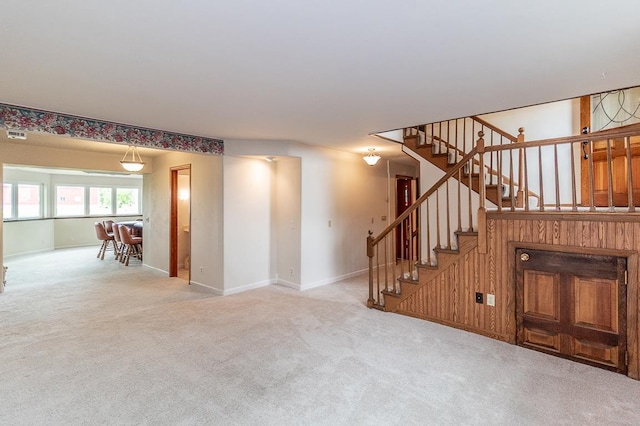 N2594 State Road 76, Hortonville, WI 54944 - unfurnished living room featuring stairs, carpet, and baseboards