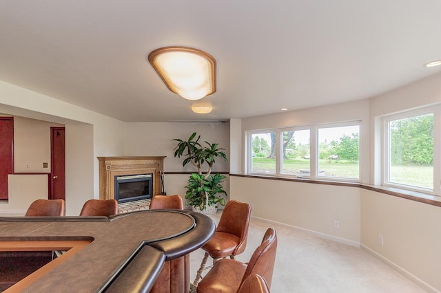 N2594 State Road 76, Hortonville, WI 54944 - dining area featuring a glass covered fireplace, baseboards, and light carpet