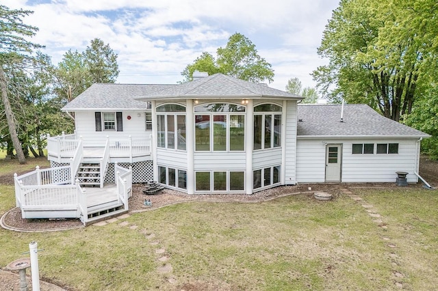 N2594 State Road 76, Hortonville, WI 54944 - back of property with a deck, a sunroom, and a yard