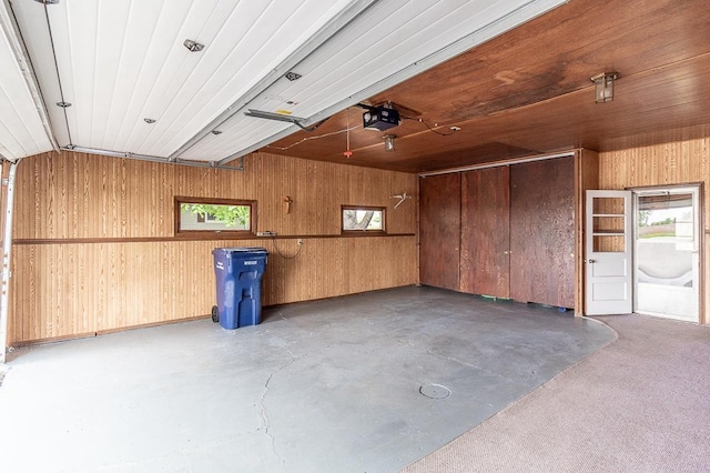 N2594 State Road 76, Hortonville, WI 54944 - garage with wood walls and a garage door opener