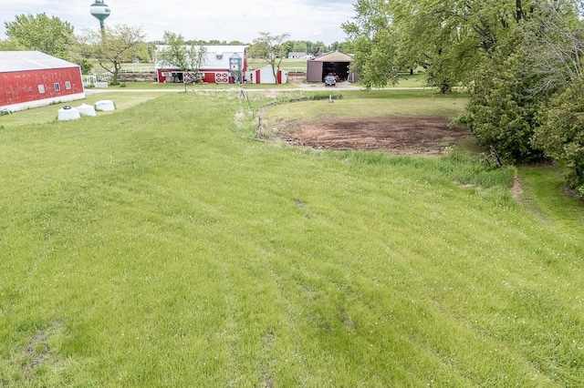 N2594 State Road 76, Hortonville, WI 54944 - view of green lawn featuring a detached carport and an outbuilding