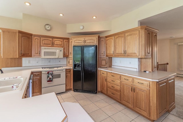 N2594 State Road 76, Hortonville, WI 54944 - kitchen featuring white appliances, a sink, a peninsula, light countertops, and light tile patterned floors