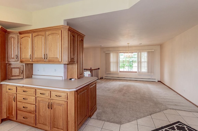 N2594 State Road 76, Hortonville, WI 54944 - kitchen featuring a baseboard radiator, light colored carpet, light tile patterned flooring, light countertops, and a peninsula