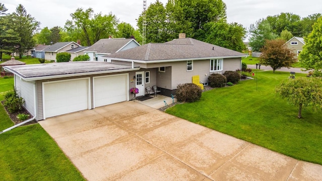 201 N 3rd St, Colby, WI 54421 - ranch-style house featuring an attached garage, a front lawn, a chimney, and concrete driveway