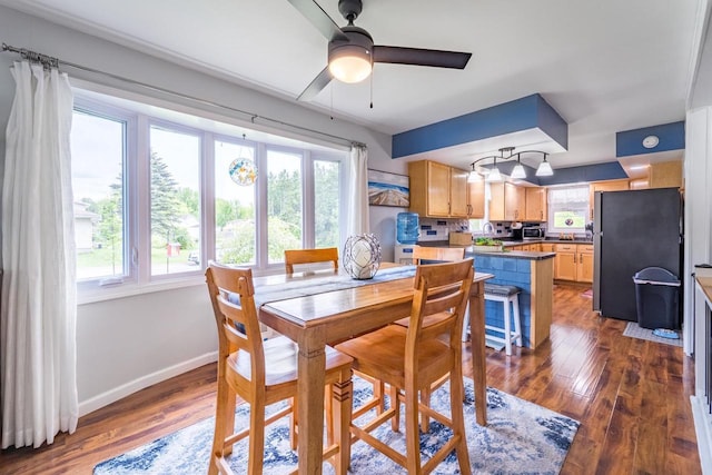 201 N 3rd St, Colby, WI 54421 - dining room with baseboards, dark wood-style floors, and ceiling fan