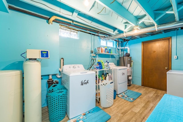 201 N 3rd St, Colby, WI 54421 - washroom featuring washing machine and dryer, wood finished floors, and water heater