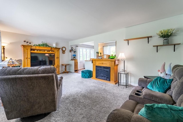 201 N 3rd St, Colby, WI 54421 - living area with light colored carpet, a fireplace, and baseboards