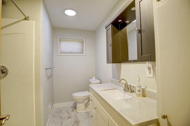 508 Frost Woods Rd, Monona, WI 53716 - full bath featuring toilet, marble finish flooring, a shower, vanity, and baseboards