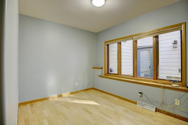 508 Frost Woods Rd, Monona, WI 53716 - spare room with wood finished floors and baseboards