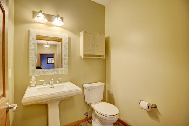 508 Frost Woods Rd, Monona, WI 53716 - half bathroom featuring toilet and baseboards