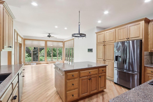 W313N4961 Chapel Ridge Rd, Hartland, WI 53029 - kitchen with stainless steel appliances, light wood finished floors, stone countertops, recessed lighting, and a ceiling fan