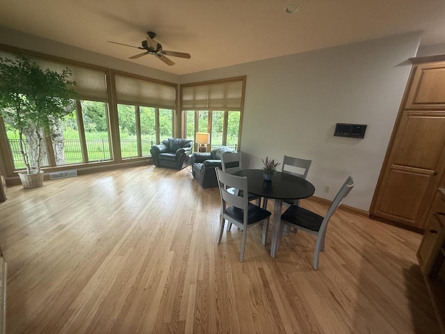 W313N4961 Chapel Ridge Rd, Hartland, WI 53029 - dining room with a ceiling fan, light wood finished floors, and baseboards