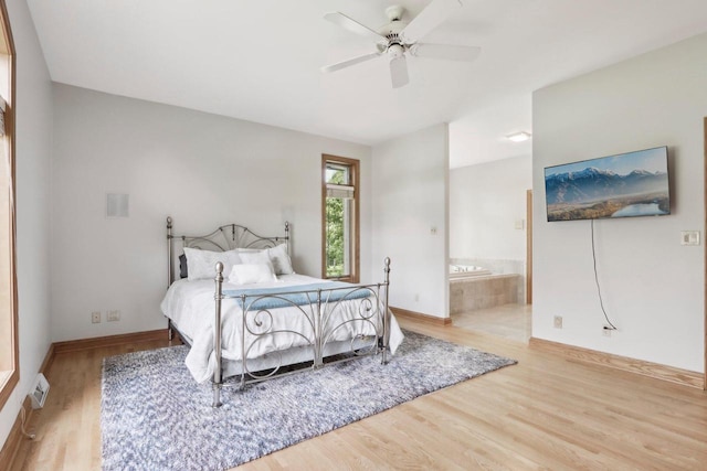 W313N4961 Chapel Ridge Rd, Hartland, WI 53029 - bedroom with wood finished floors, baseboards, ensuite bathroom, and ceiling fan