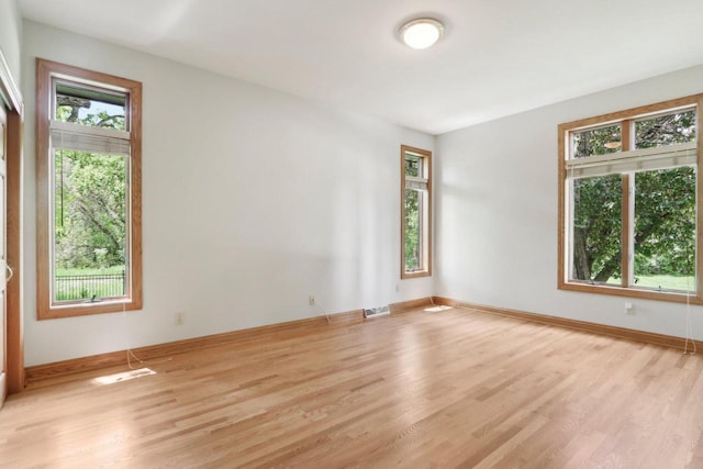 W313N4961 Chapel Ridge Rd, Hartland, WI 53029 - spare room featuring wood finished floors and baseboards