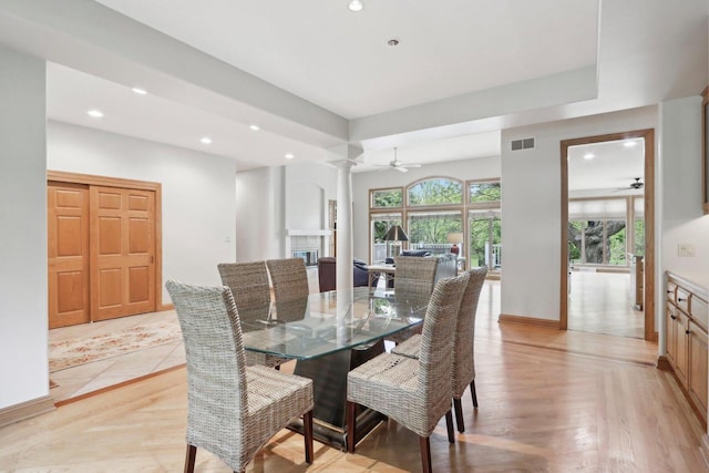 W313N4961 Chapel Ridge Rd, Hartland, WI 53029 - dining room featuring ceiling fan, recessed lighting, ornate columns, a glass covered fireplace, and baseboards