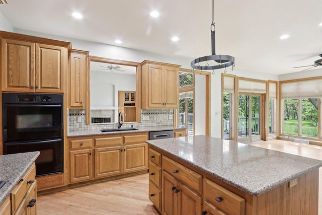 W313N4961 Chapel Ridge Rd, Hartland, WI 53029 - kitchen with a ceiling fan, a sink, decorative backsplash, recessed lighting, and light wood-style flooring