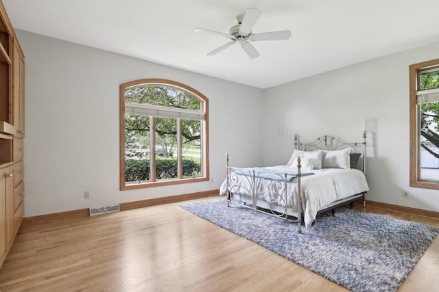 W313N4961 Chapel Ridge Rd, Hartland, WI 53029 - bedroom featuring light wood-style flooring, baseboards, and ceiling fan